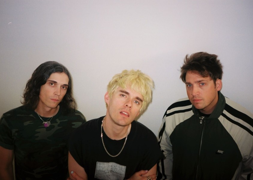 Waterparks infront of a white wallx